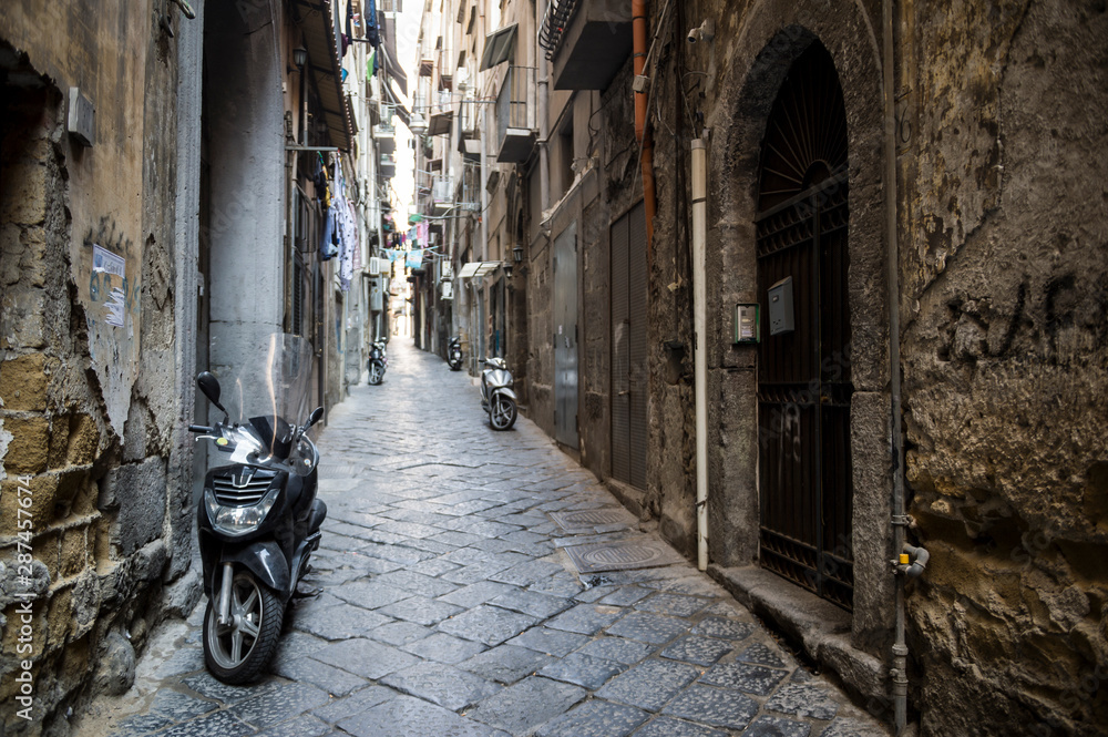 Door Stickers Scenic View Of Typical Narrow Alleyway Lined With Scooters And Laundry Lines In The Medieval Centro Storico Of Naples Italy Nikkel Art Door Stickers Scenic View Of Typical Narrow Alleyway Lined With Scooters And Laundry Lines In The Medieval Centro Storico Of Naples Italy Nikkel Art
