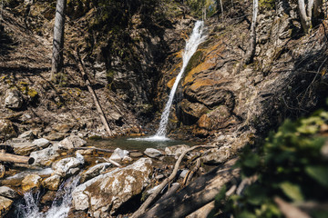 Ankova slapova waterfall near Zgornje Jezersko, Kamnik Savinja Alps, Slovenia. Beautiful waterfall on an alpine mountain creek in slovenian alps. Ankova waterall and mountain stream.