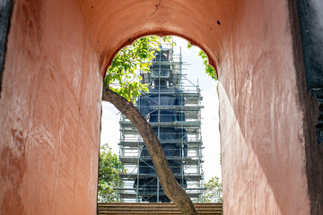 Wall Mural - Big Standing Buddha under renovation with door frame in  Analyo Thipayaram temple