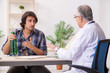 © Elnur - Young male alcoholic visiting old doctor