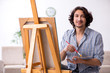 © Elnur - Young handsome man enjoying painting at home