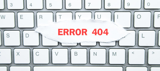 Canvas Print - Error 404. Torn paper on computer keyboard