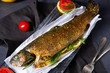 baked trout with herb filling and tomatoes