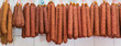 Many dried sausages on the hook in the butcher shop, banner