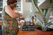 © Stock Rocket - Mother holding her baby and preparing lunch