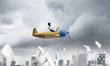 © adam121 - Businessman in aviator hat driving paper plane