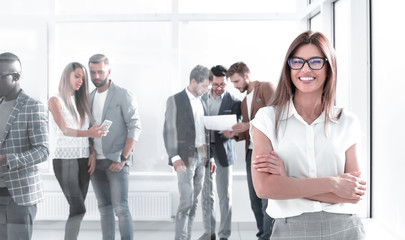 Wall Mural - business woman and a group of employees standing in the office