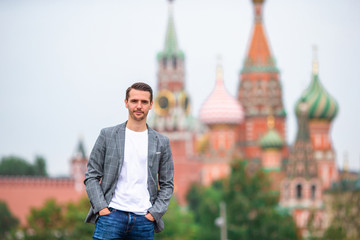 Happy young urban man in european city.