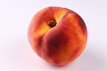 Canvas Print - One peach on a white background close up