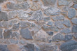 © Алексей Р - Background of natural stone. Large parts of the wall are flooded with concrete. Gray stone wall background.