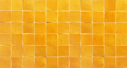 Wall Mural - Old retro orange ceramic tile texture background. Orange square tiled wall.