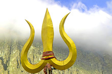 Trident Weapon Of Lord Shiva Placed Ahead Of A Cloudy Mountain-image