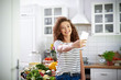 © gpointstudio - Woman taking selfie in the kitchen
