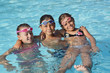 © goodluz - Cheerful group of kids at the swimming-pool