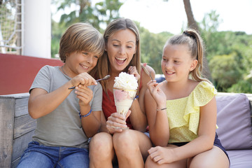 Mother and kids eating ice cream