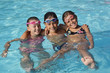 © goodluz - Cheerful group of kids at the swimming-pool