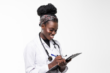 Portrait of happy african medical intern doctor writing on clipboard isolated on white background