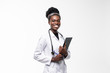 © F8  \ Suport Ukraine - Portrait of happy african medical intern doctor writing on clipboard isolated on white background