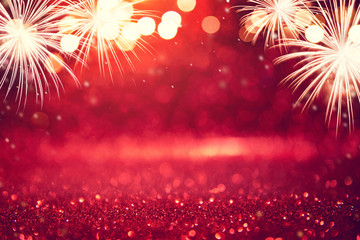 Wall Mural - abstract background holiday, red and gold fireworks and bokeh in new year eve and copy space.