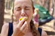 © Андрей Репетий - Emotional face of girl eating lemon in the forest
