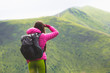 © Андрей Репетий - Girl hiker looking into the distance at the beauty of surrounding nature and mountains