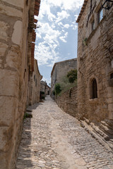 Paved street Village of Lacoste with old stone houses in Provence France