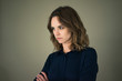 © Westend61 - young woman with arms crossed, looking annoyed