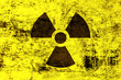 Radioactivity symbol on yellow grunge background