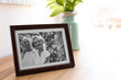 © New Africa - Portrait of senior couple in frame on table indoors. Space for text