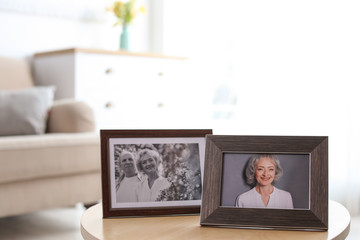 Sticker - Portraits in stylish frames on table indoors