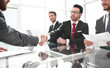 © ASDF - handshake of business people at a working meeting