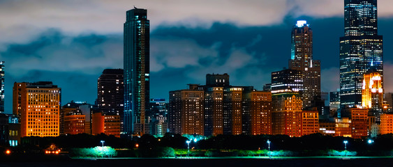 Poster - Downtown Chicago cityscape skyline at night with Lake Michigan in the foreground