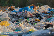 garbage dump with lot of plastic bag and bottles and other waste