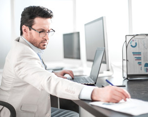 Wall Mural - businessman writing down information in a notebook