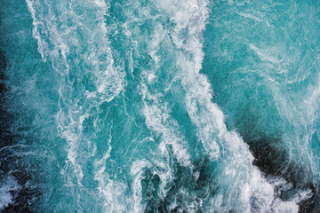 bruarfoss waterfall in iceland as an abstract of the blue water and whitewater from above