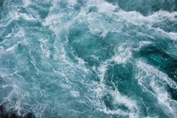 Wall Mural - bruarfoss waterfall in iceland as an abstract of the blue water and whitewater from above