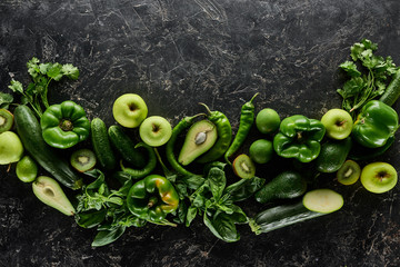 Wall Mural - top view of apples, avocados, cucumbers, kiwi, limes, peppers, greenery and zucchini