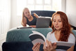 © Monkey Business - Two Female College Students In Shared House Bedroom Studying Together