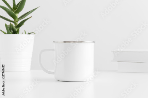 Download Enamel Mug Mockup With A Aloe Vera In A Pot And Books On A White Table Stock Photo Adobe Stock