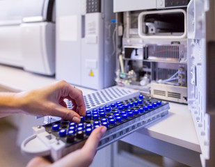 the laboratory scientist prepares samples for download to high-performance liquid chromatograph mass