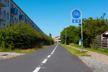 Dedicated two lane bike road through a residential area.