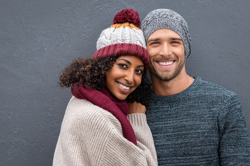 Wall Mural - Happy young couple in winter clothes