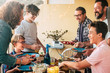 © simona - Happy cheerful group of caucasian people mixed generation and ages have fun together having dinner or lunch together - concept of party and friendship for adults and teenagers