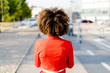 © Westend61 - Back view of young woman wearing fashionable red suit jacket