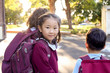 © Claire Bonnor/Austockphoto - School children walking through school with backpacks