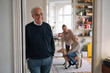 © Westend61 - Happy grandfather with wife and grandson in background at home