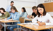 © JackF - Girl writing test in classroom