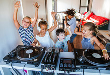 Young Friends Having A Party At The Turntable