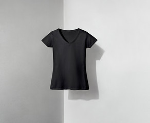 Wall Mural - Black T-shirt for Lady on Shadowed Background