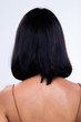 © Jade - Back side view of Women to show short blonde curl Hair style before after applying hair styling, studio lighting gray background isolated, copy space for text logo